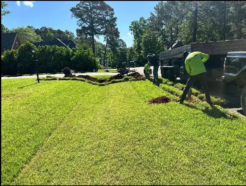 Crew installing fresh sod on a customer property